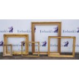 A group of five frames, including a 19th century gilt plaster swept frame, two further 19th century