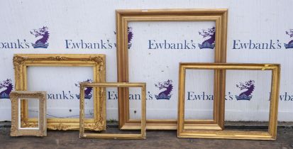 A group of five frames, including a 19th century gilt plaster swept frame, two further 19th century