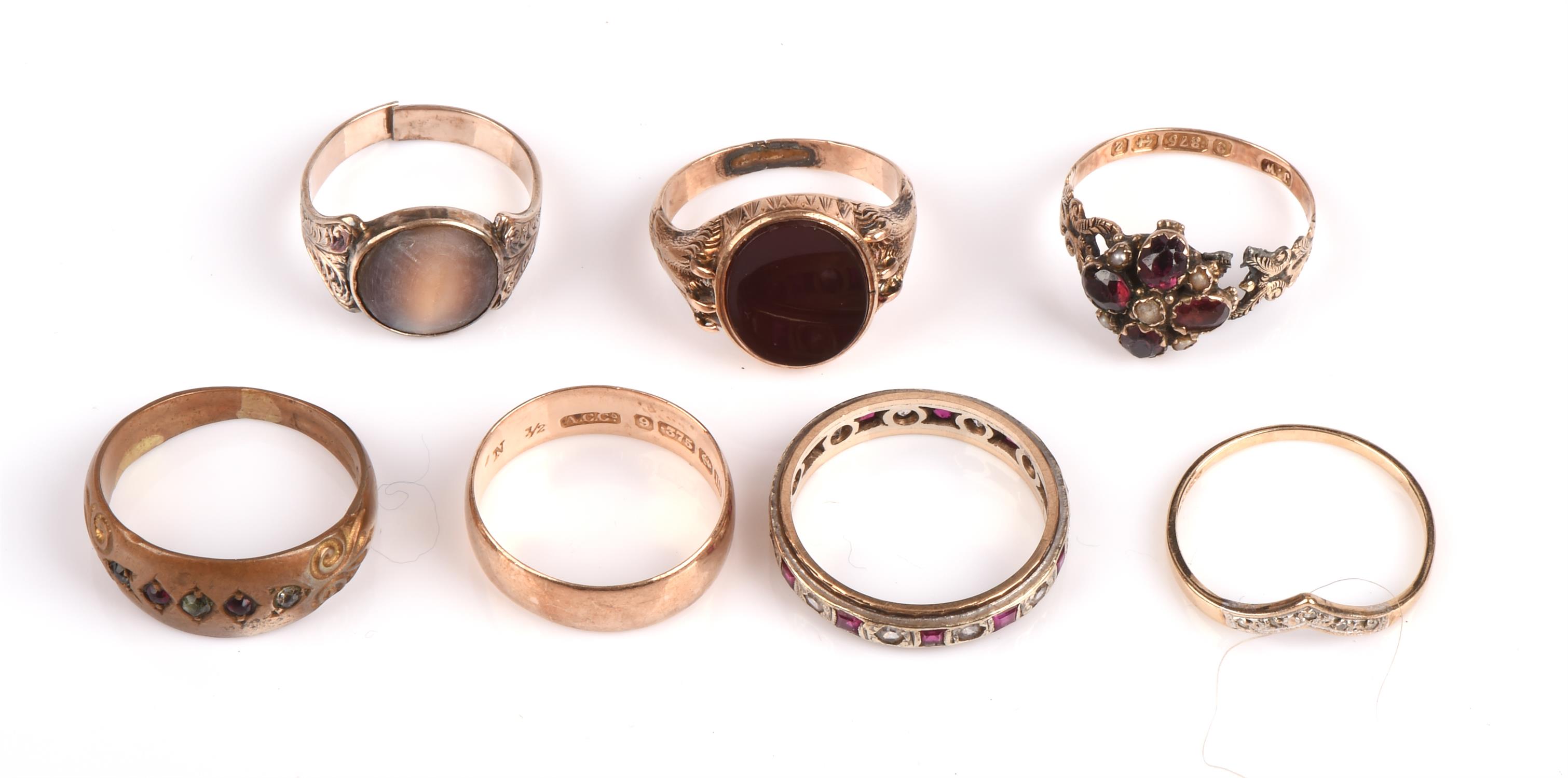 A selection of rings, including a carnelian signet ring, hallmarked Birmingham 1975, size J, a 5.