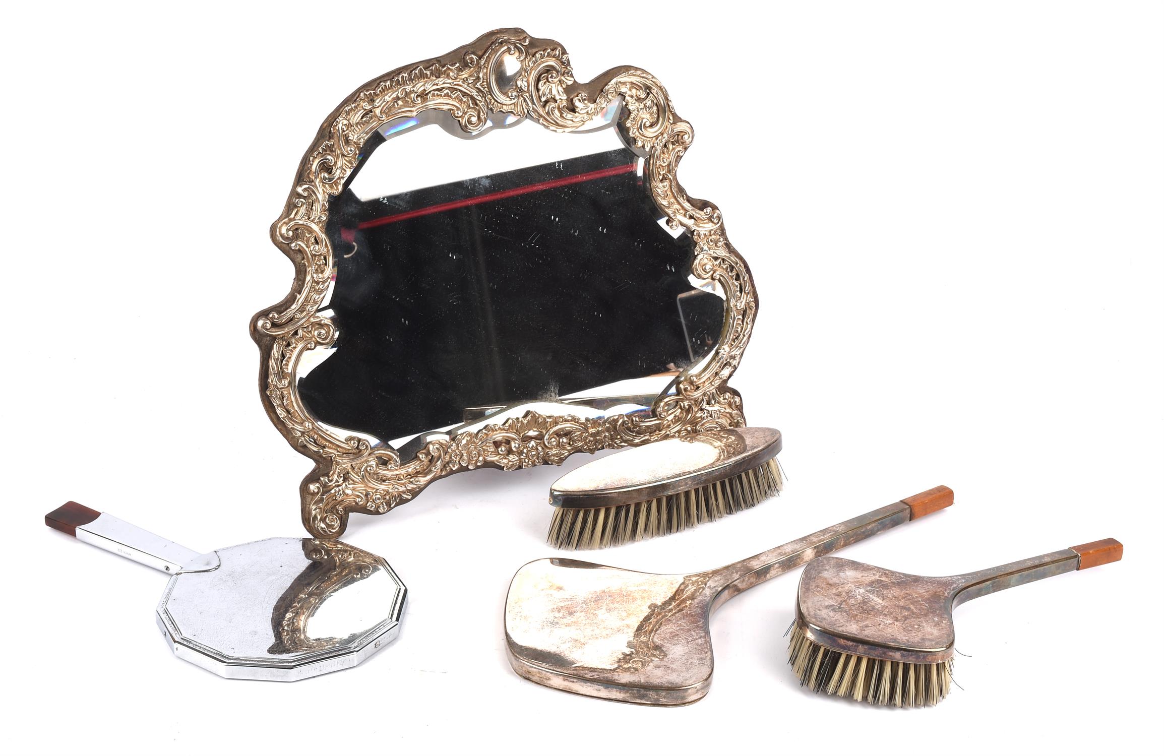 A WMF silver plated three piece dressing set, early 20th century, with two brushes and a hand