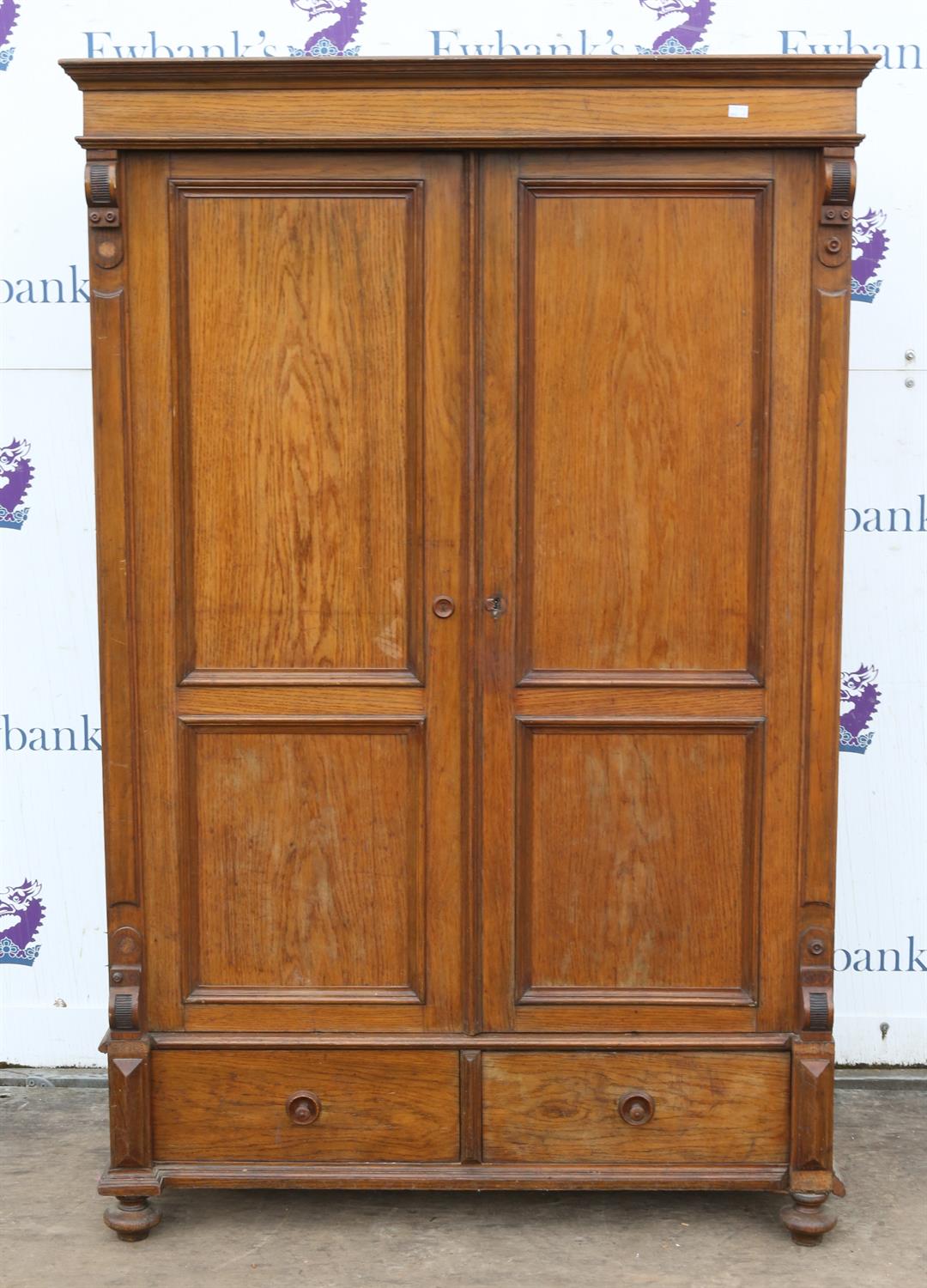 A Satinwood Armoire, Crested cornice over two panel doors over single drawer raised on turned