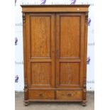 A Satinwood Armoire, Crested cornice over two panel doors over single drawer raised on turned