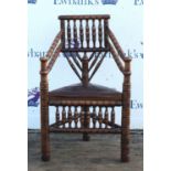 An Edwardian oak turner's chair,1900s, bobbin and ring turned, with later leather inset seat,