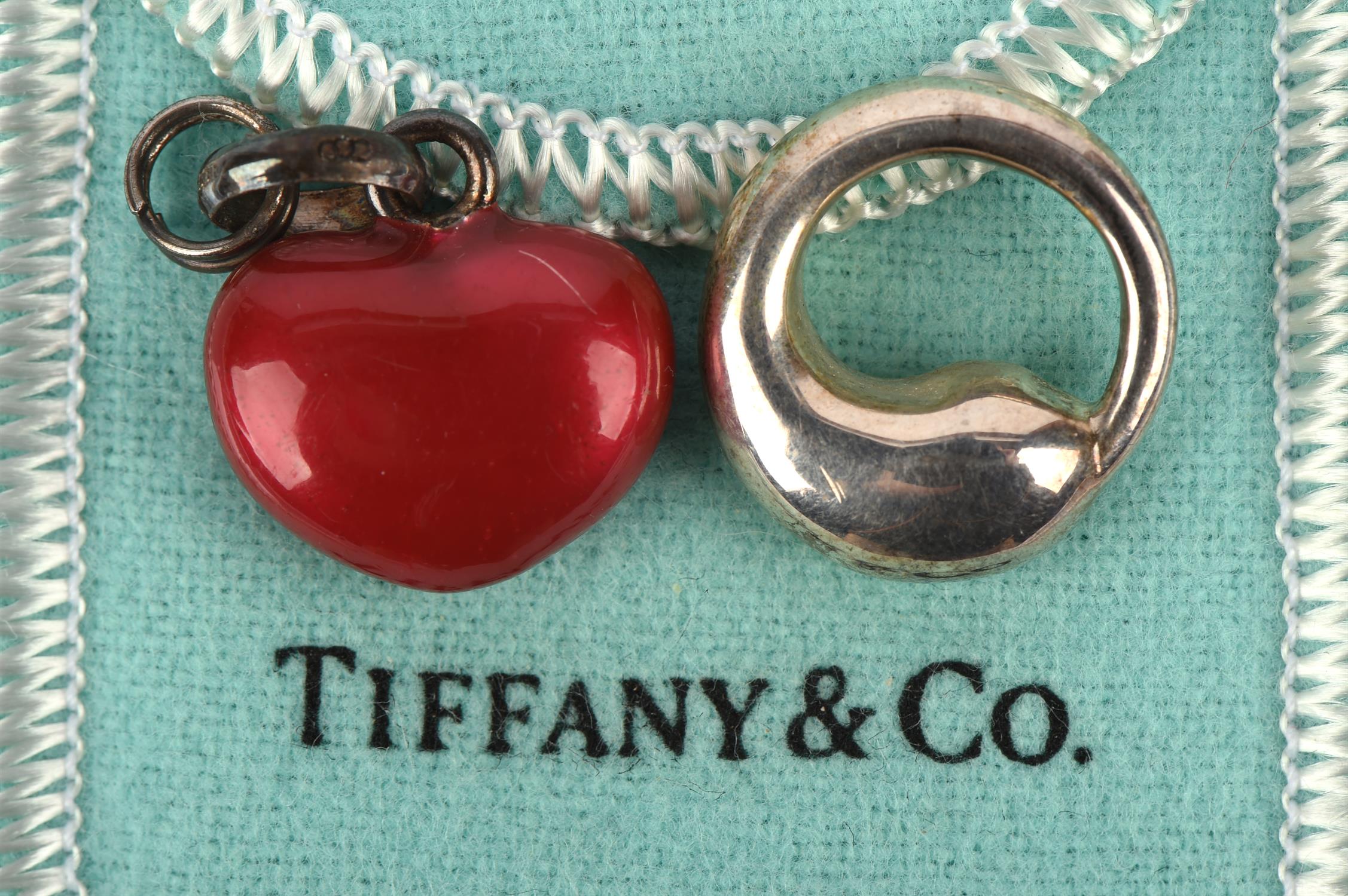 A silver Links of London red enamel heart charm, together with a Tiffany & Co, Elsa Peretti pendant