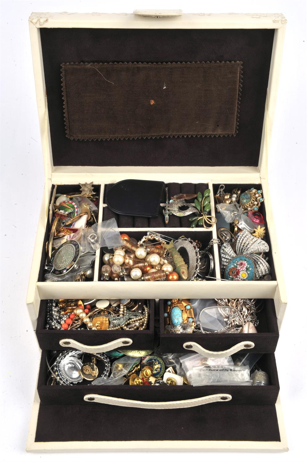 A large cream leather jewellery box containing costume jewellery, including a micro mosaic brooch,