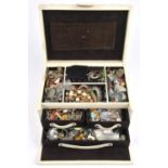 A large cream leather jewellery box containing costume jewellery, including a micro mosaic brooch,