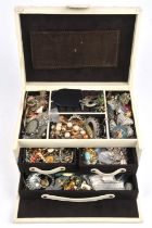 A large cream leather jewellery box containing costume jewellery, including a micro mosaic brooch,