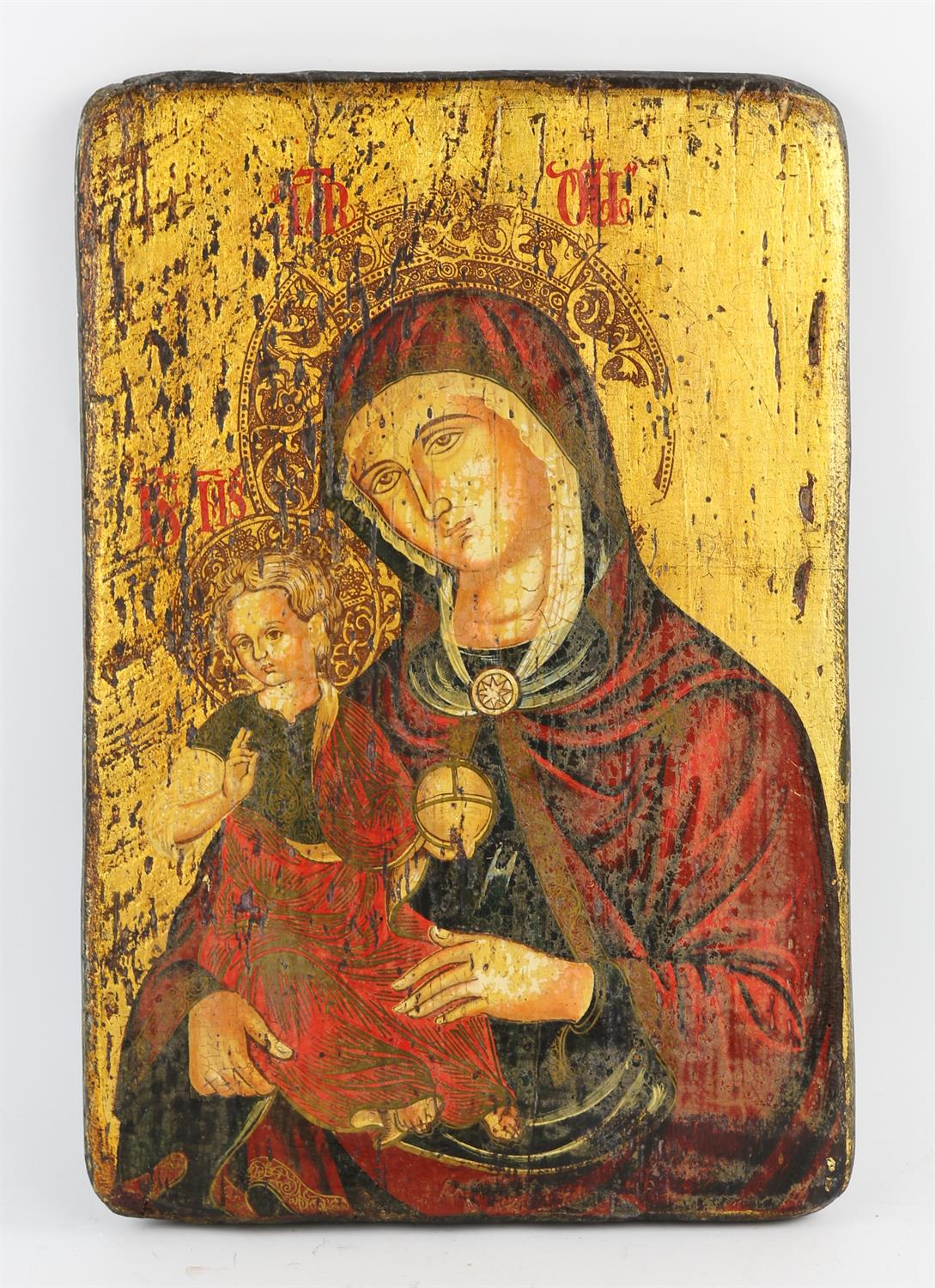 An early 20th century Russian Icon, titles to the rear 'Vierge A L'Enfant', polychrome decorated