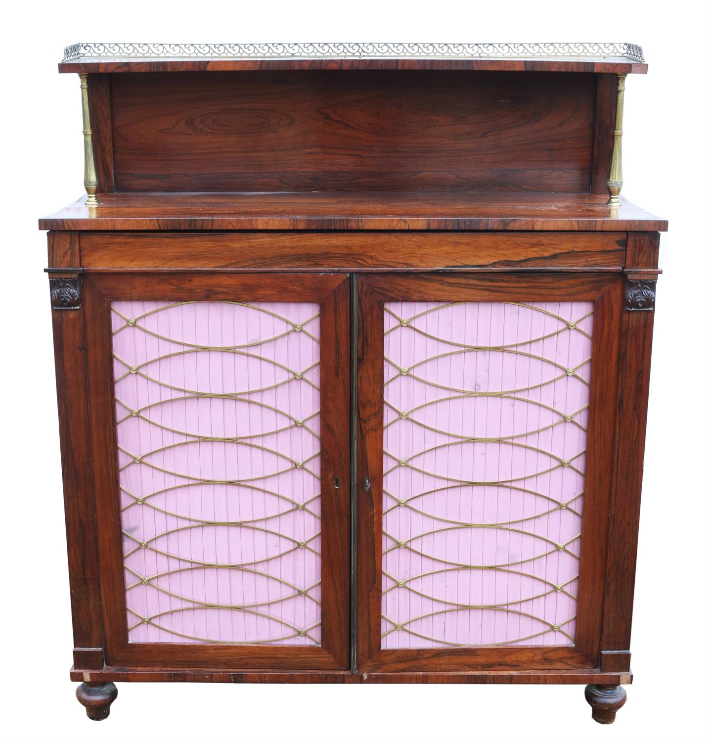 A Regency rosewood side cabinet, the rear gallery on brass supports, the narrow drawer above a pair