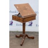 A German mahogany and banded writing table, 1840s, the ratchet adjustable top above two lateral