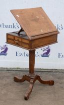 A German mahogany and banded writing table, 1840s, the ratchet adjustable top above two lateral