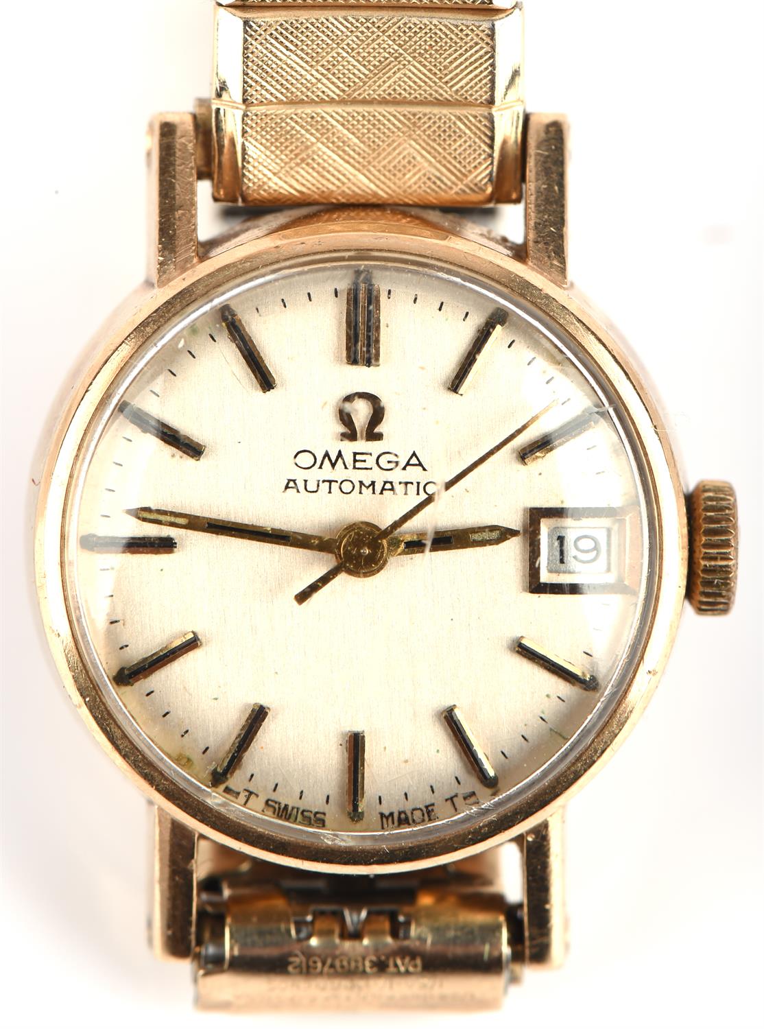 Omega a Ladies gold automatic wristwatch the signed dial with baton hour markers,