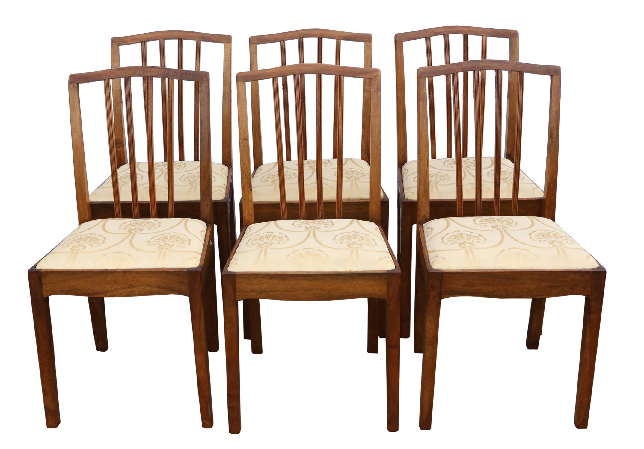 A set of six George III style walnut dining chairs, 1930s/40s, shaped top rails, the stick splats