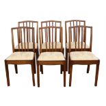 A set of six George III style walnut dining chairs, 1930s/40s, shaped top rails, the stick splats