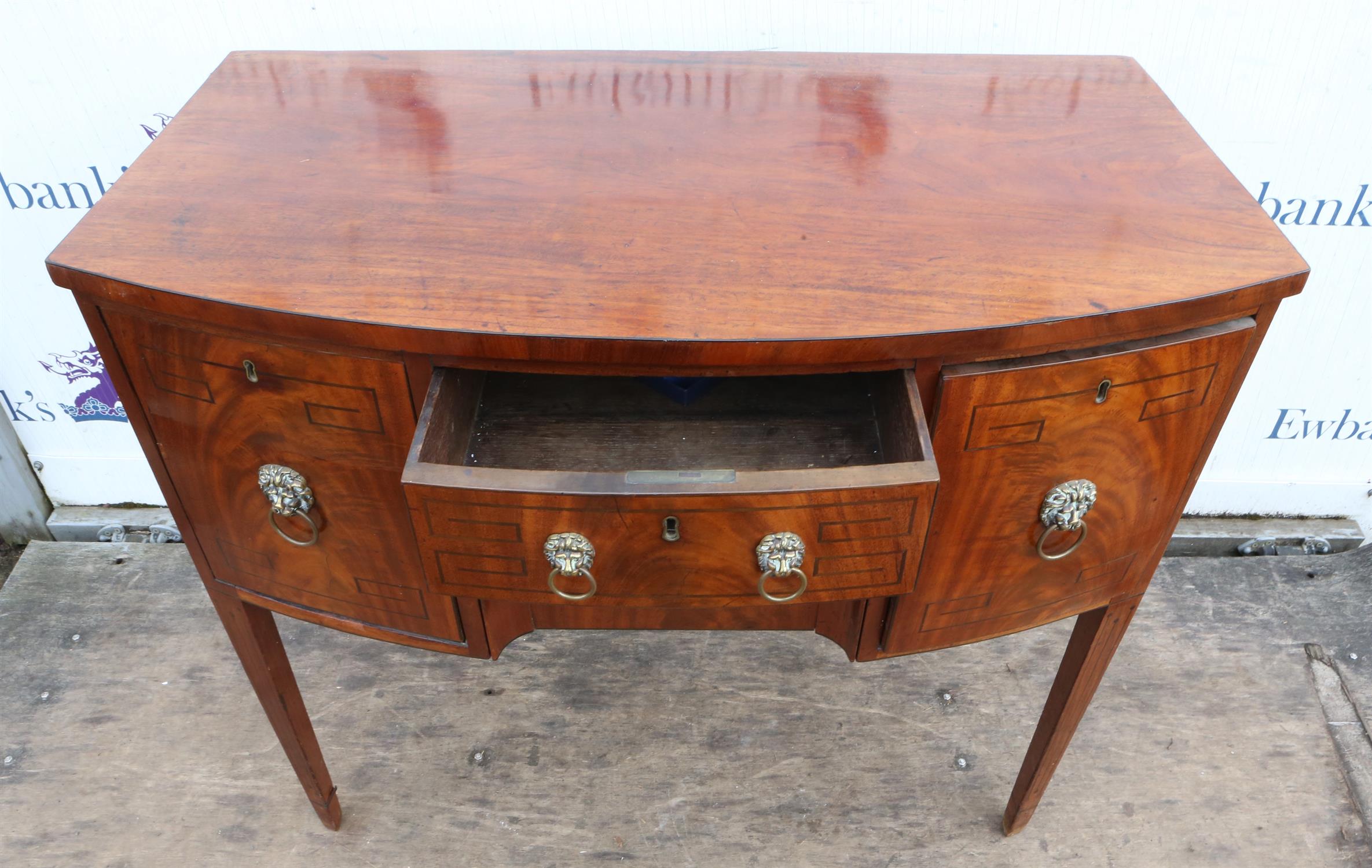 A Regency mahogany bowfront sideboard, ebony strung, the central drawer above a drawer flanked by a - Image 2 of 3