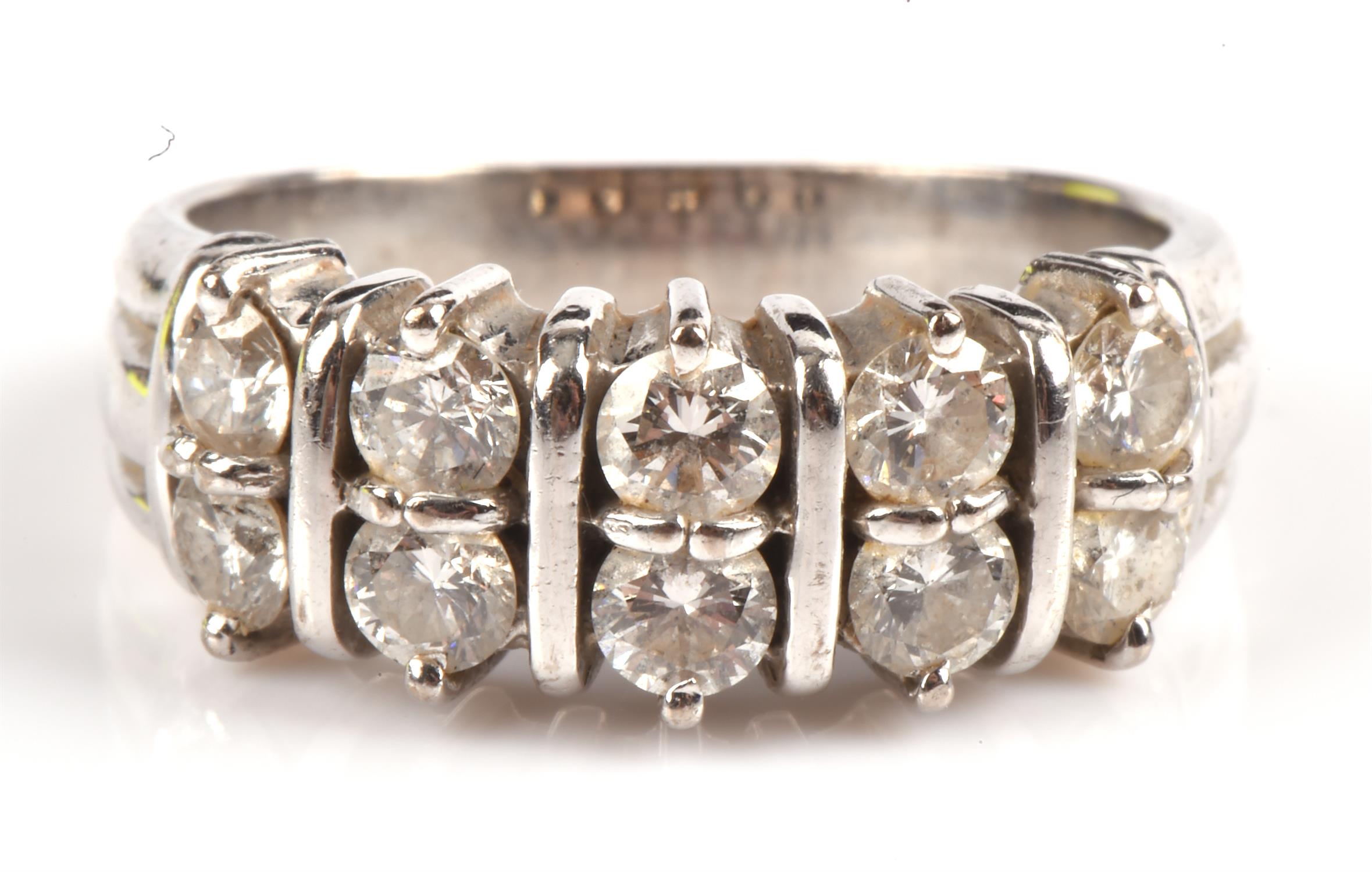 Diamond ring in 18 ct white gold, hallmarked London 2010, set with ten brilliant cut diamonds,