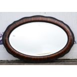 Oval mahogany mirror, 20th Century, with ripple edge moulding, 56 x 84cm