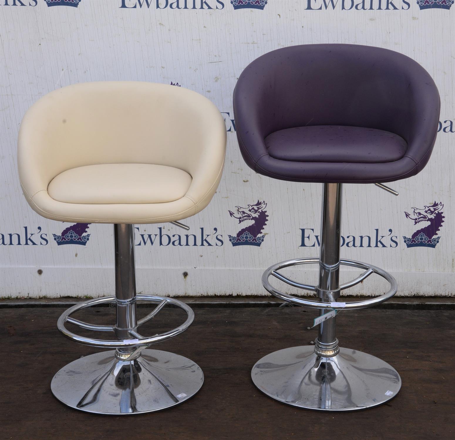 Pair of modern bar stools on chrome base supports.