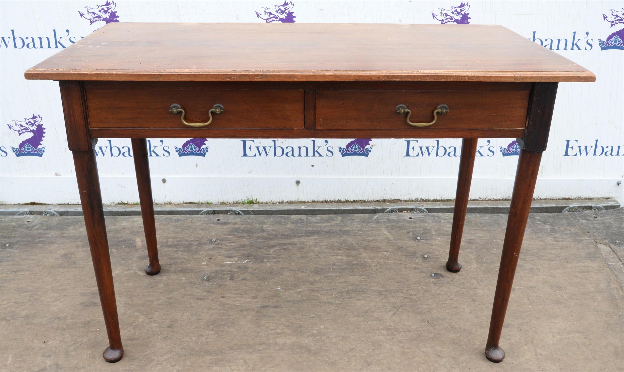 An Edwardian mahogany writing table, in the George II style, with two drawers, H 77cm, W 111cm,