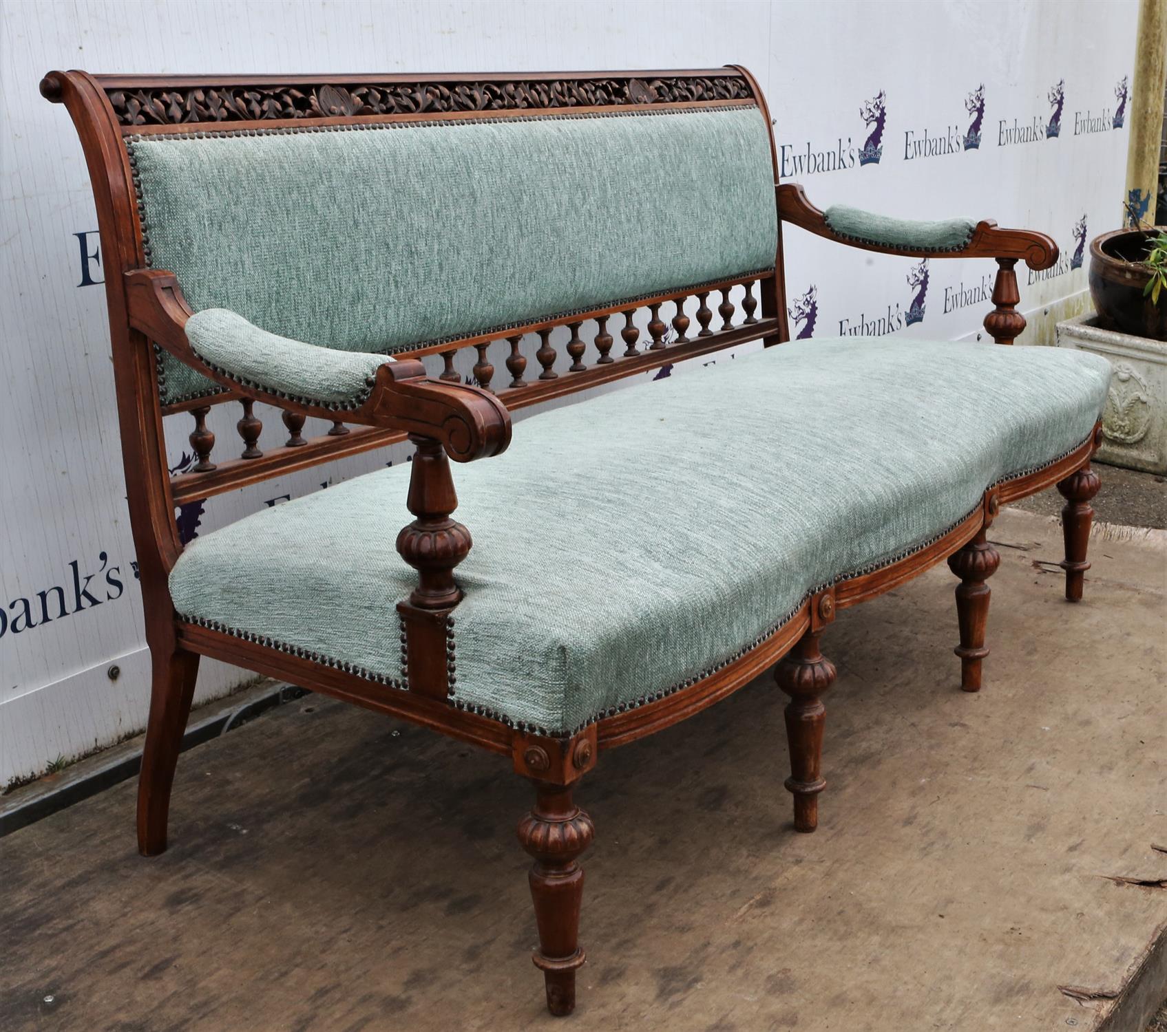 A late Victorian walnut and upholstered settee, the top rail pierced and leaf carved, - Image 4 of 6