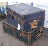 Matched pair of Steamer trunks, in green and red colourway, applied with shipping labels,