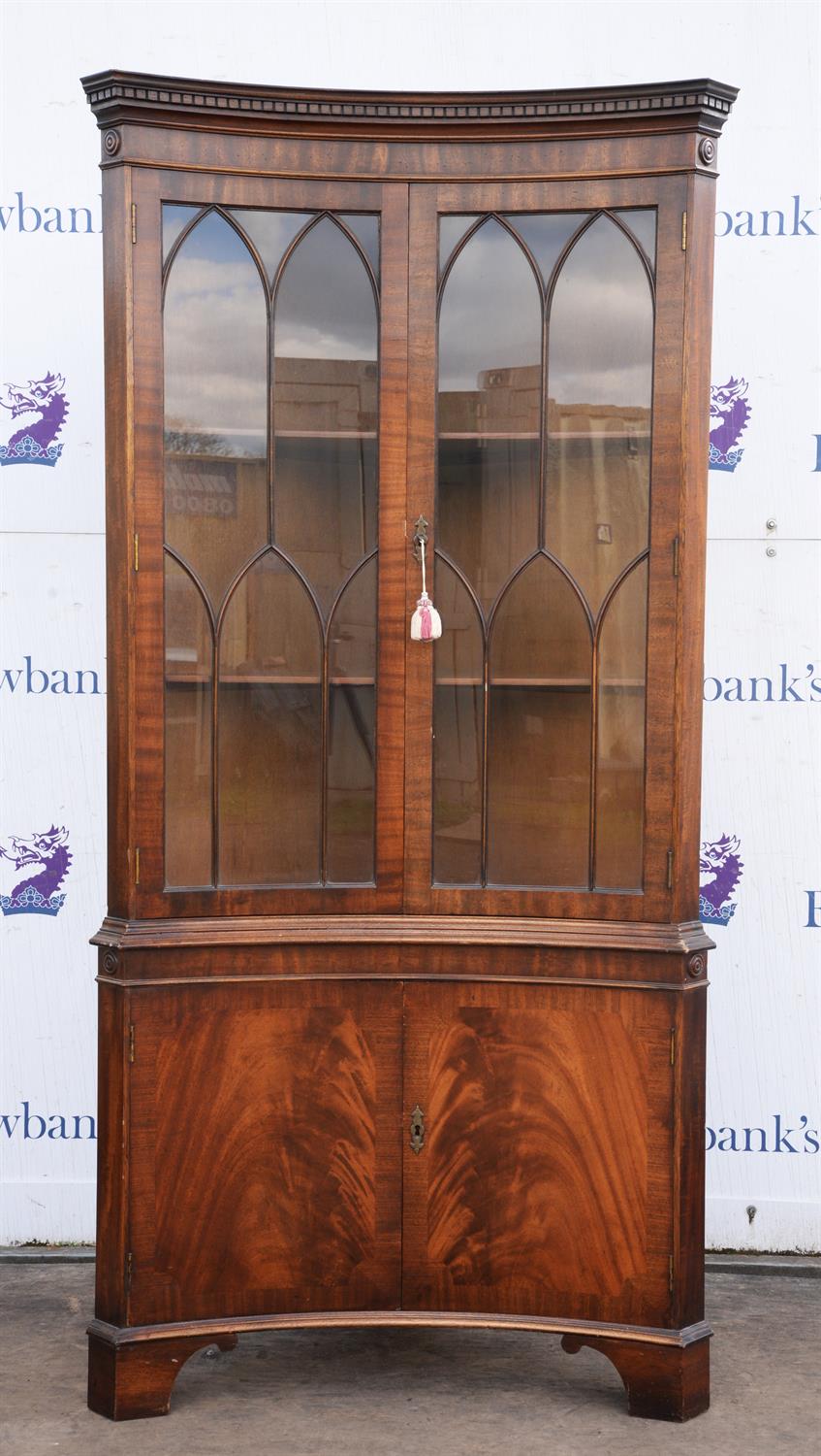 George III styl mahogany corner cupboard, with two astragal glazed doors, enclosing two shelves,