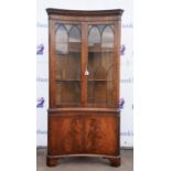George III styl mahogany corner cupboard, with two astragal glazed doors, enclosing two shelves,