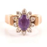 Amethyst and diamond ring, oval cut amethyst surrounded by ten single cut diamonds,