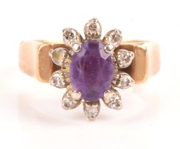 Amethyst and diamond ring, oval cut amethyst surrounded by ten single cut diamonds,