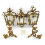 A pair of early-mid 20th century gilt brass hall lanterns of square tapering form,
