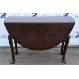 A George II mahogany oval drop leaf table, H 72cm, W 110cm, L 124cm