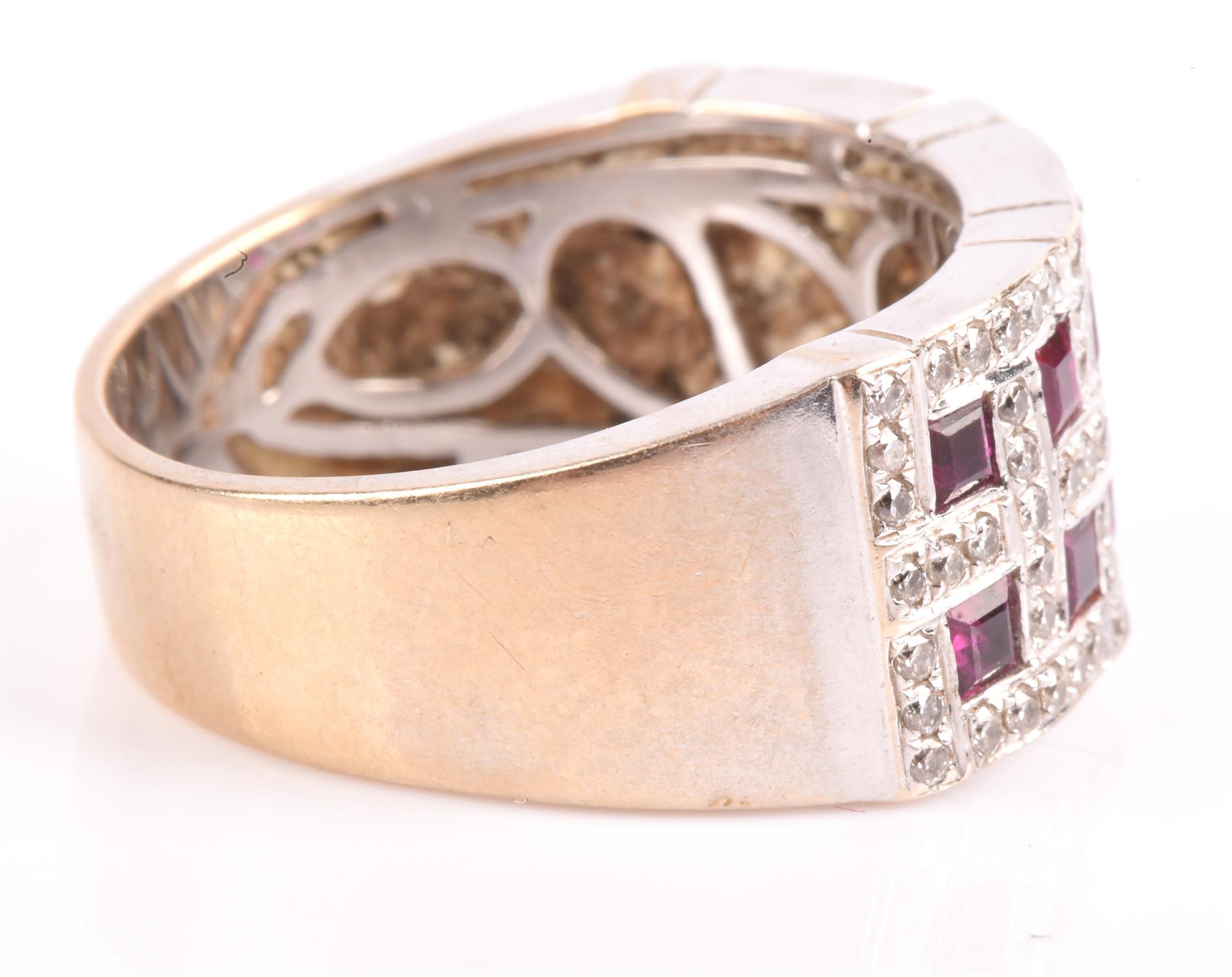A ruby and diamond band ring, set with twelve square cut rubies, each surrounded by round brilliant - Image 2 of 4