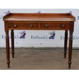 A Victorian mahogany side table, 1840s, the three quarter gallery top above two drawers,