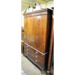 A Victorian mahogany linen press with broken arch pediment. Height 219 cm, width 128cm.