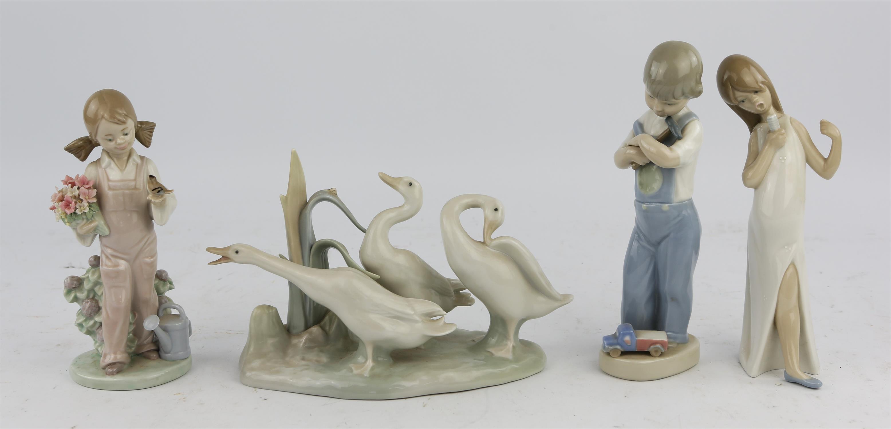 A collection of Lladro porcelain figures including 'Beggar' No 1094, 'Debbie and her Doll' No1379, - Image 3 of 3