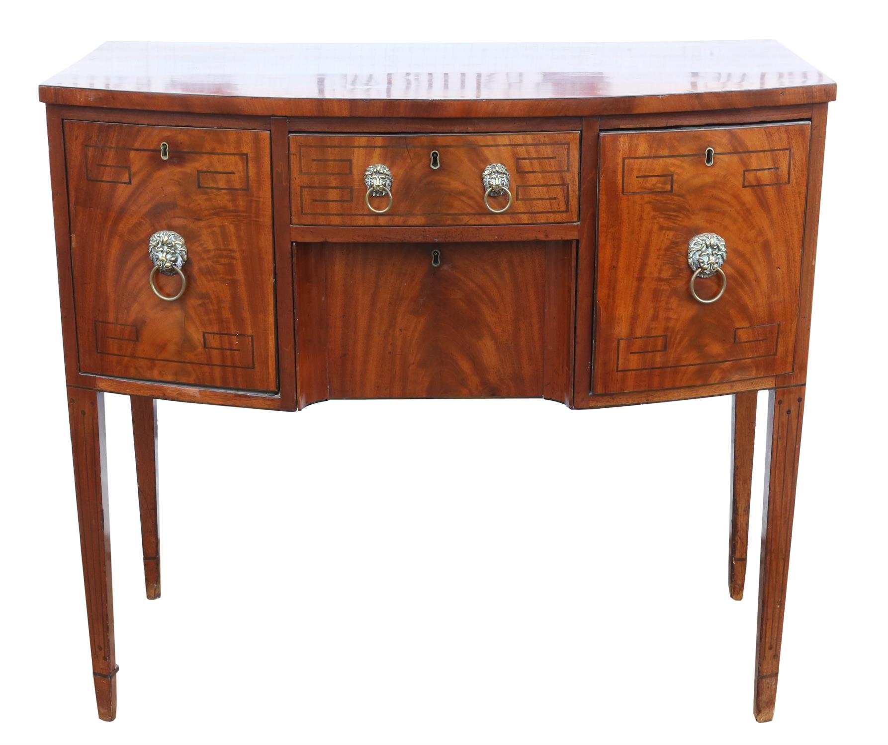 A Regency mahogany bowfront sideboard, ebony strung, the central drawer above a drawer flanked by a