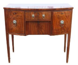 A Regency mahogany bowfront sideboard, ebony strung, the central drawer above a drawer flanked by a