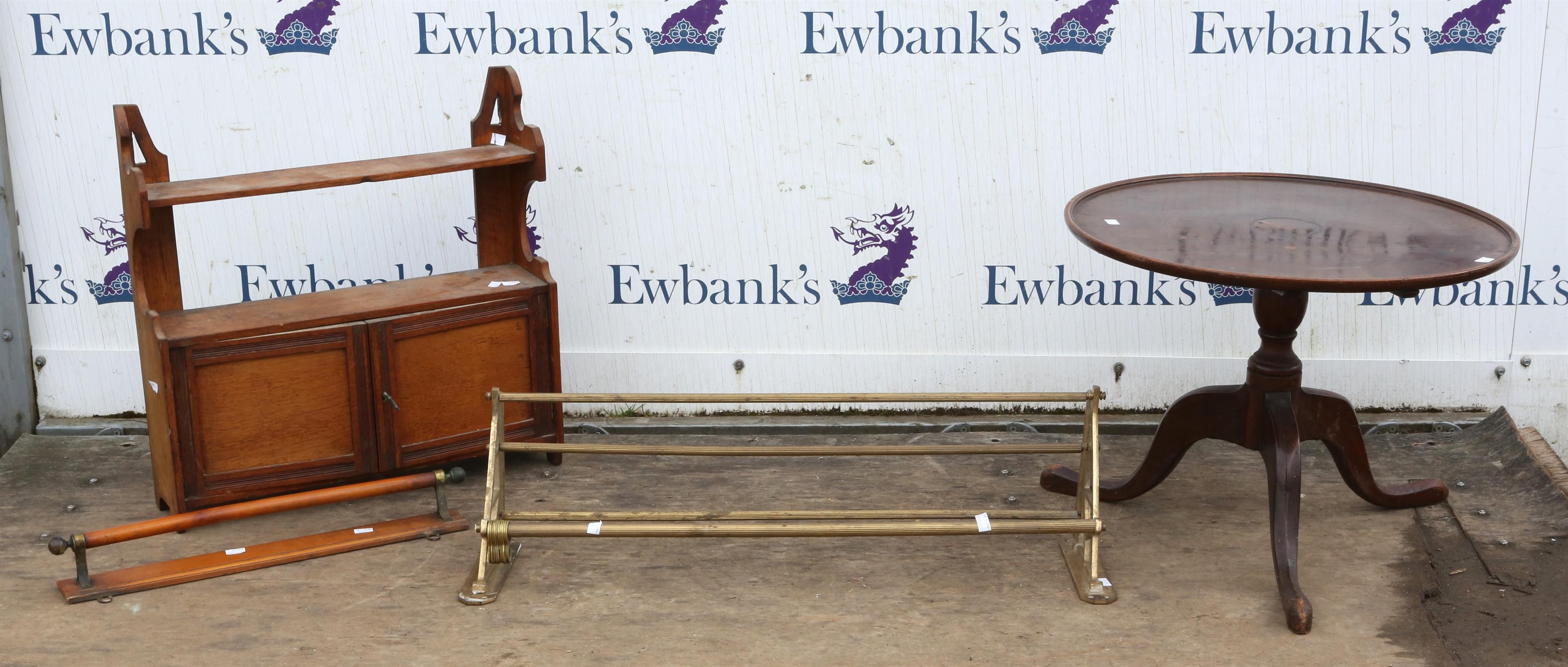 A mahogany circular topped occasional table raised on tripod supports terminating in pad feet.