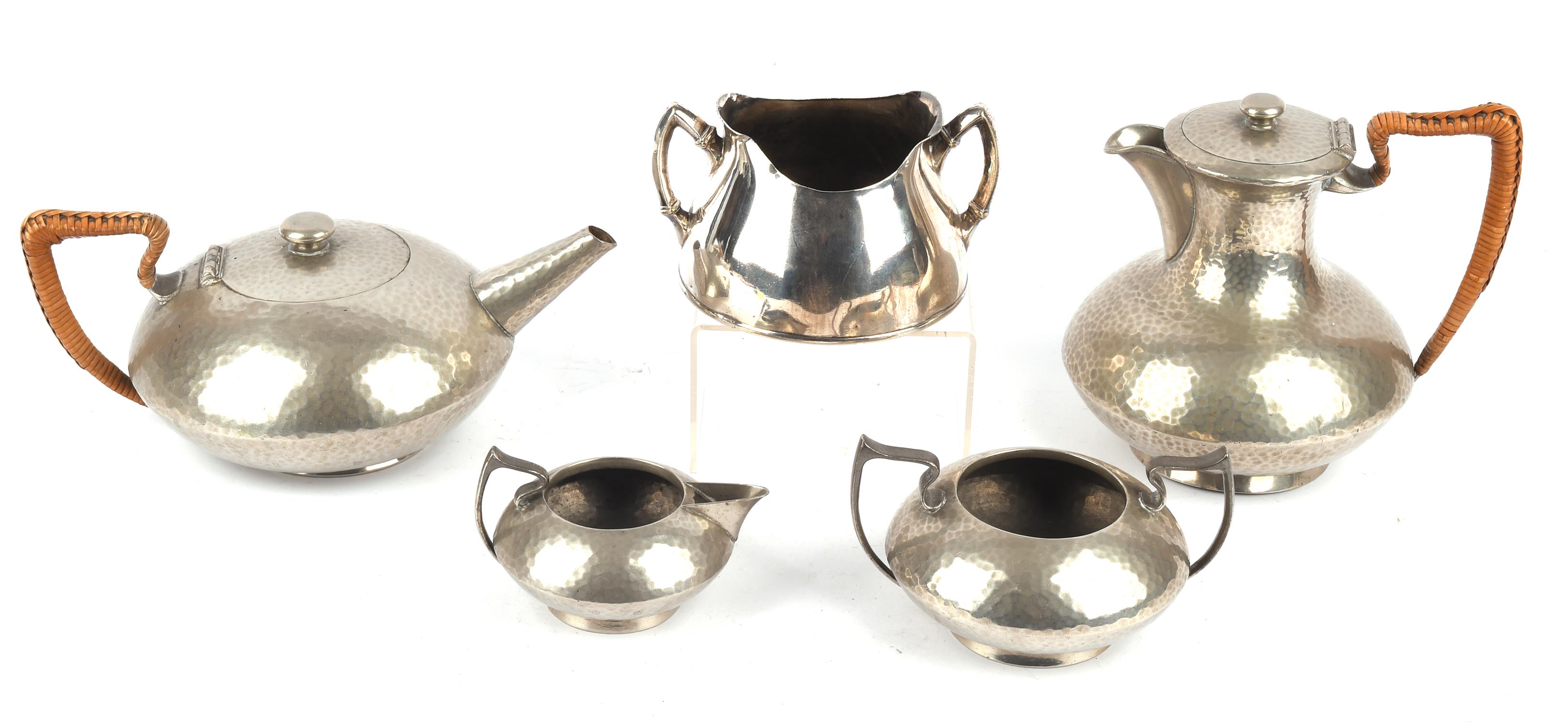 An English Pewter four piece tea and coffee set, planished and with raffia handles,