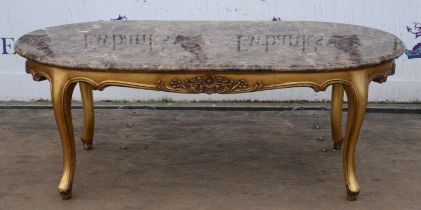 A Louis XVI style giltwood coffee table, mid 20th century, with an oval mottled brown marble top,