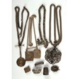 A selection of mainly antique silver jewellery, including three brooches, three chains, a thimble,