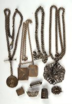 A selection of mainly antique silver jewellery, including three brooches, three chains, a thimble,