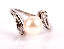 Pearl and diamond twist ring, with a 8mm cultured pearl with a round brilliant cut diamond to each