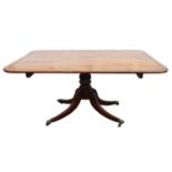 A Regency mahogany breakfast table, ebony banded, the tilt-top with rounded corners,