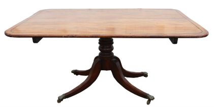 A Regency mahogany breakfast table, ebony banded, the tilt-top with rounded corners,