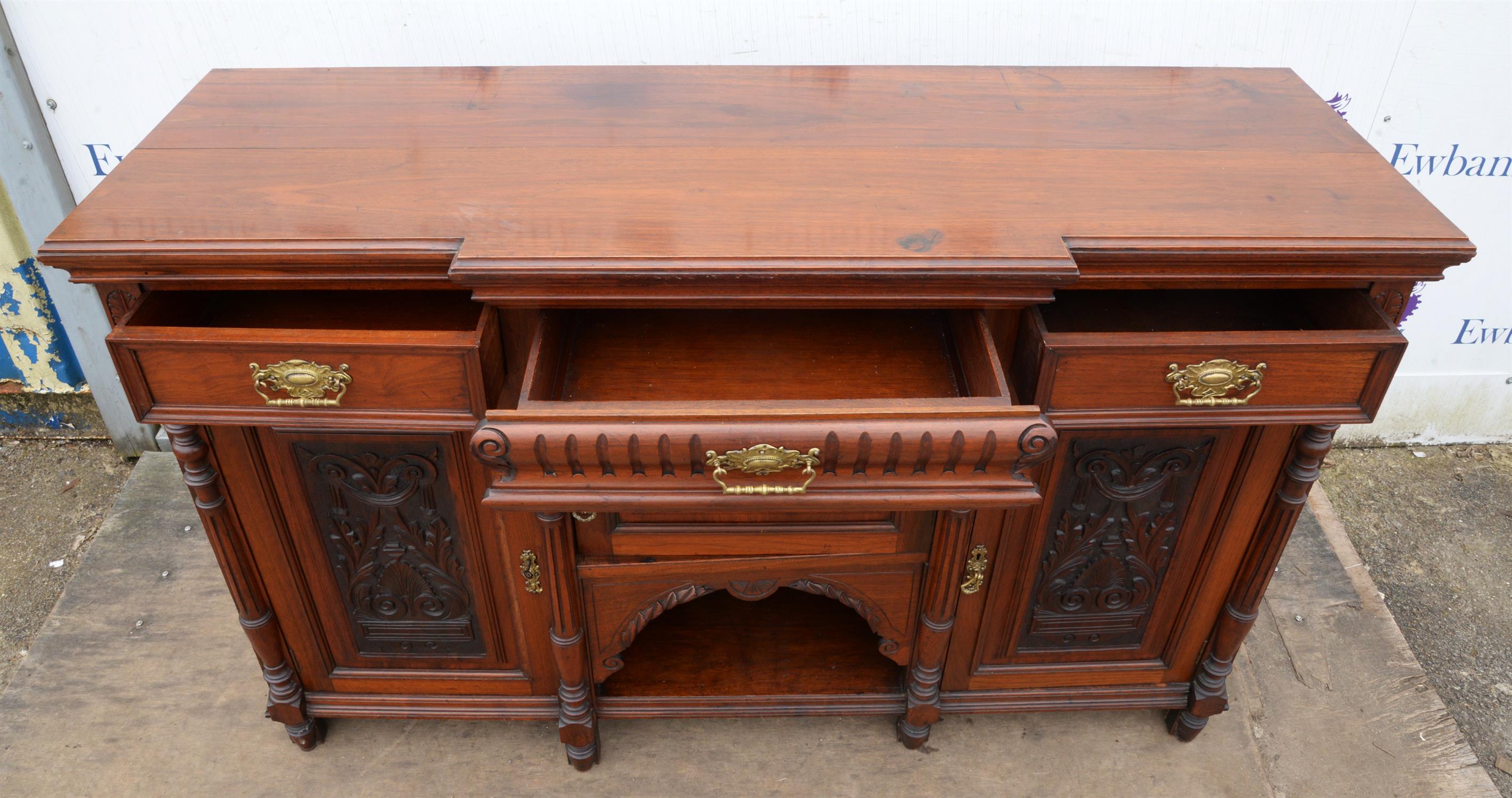 A late Victorian walnut sideboard, of breakfront form, doors scroll and anthemion carved, - Image 3 of 3