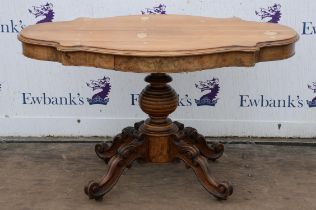 A French Louis XV style centre table, 1840s, the cartouche form oak top above a frieze with two