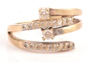 A cubic zirconia set crossover ring, mounted in stamped 9 ct, ring size R