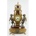 Louis XVI style gilt metal and burgundy porcelain mantel clock, 20th Century, with satyr mounts,