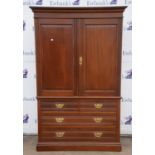 An Edwardian mahogany linen press, the panel cupboard doors enclosing four sliding trays, H 208cm,